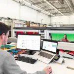 Man printing to two HP Z9 Pro 64 inch Printers