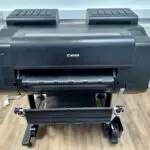 Large format printer printing a colorful poster