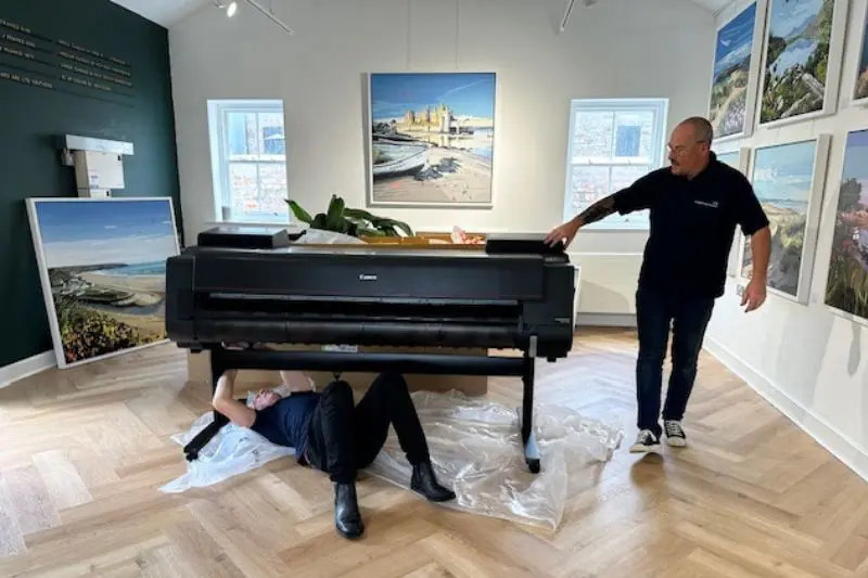 2 men installing a Canon Wide Format Pro Printer