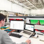 Man printing to two HP Z9 Pro 64 inch Printers