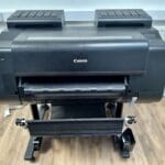 Large format printer printing a colorful poster