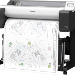 Canon imagePROGRAF TM-610 A0 plotter on its stand printing a colour site plan